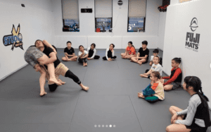 Children participating in a boxing class at Kings Combat Forest Hills.
