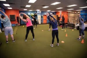 People participating in a fitness class at JG Fitness & Performance gym.
