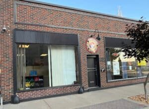Exterior view of Three Rivers Martial Arts Academy building with logo and large windows.