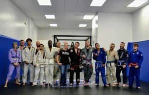 Group of Brazilian Jiu Jitsu practitioners in training at a gym.