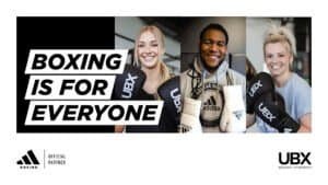 Group of diverse people with boxing gloves at UBX gym.