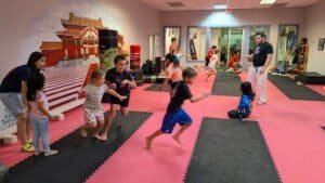 Children participating in martial arts training at New England Rendokan dojo.