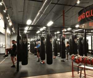 Boxing training with punching bags at TITLE Boxing Club Pensacola.