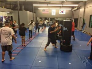 Kids and adults practicing martial arts at Legacy Martial Arts Center.