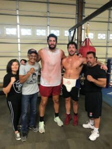 Group of boxers and trainers after training session at Tulare Athletic Boxing Club.