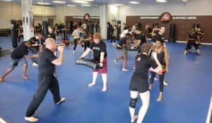 Kids and adults practicing martial arts in a training class at Montgomery Martial Arts.