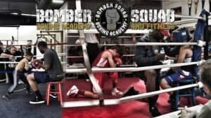 Boxers training in a boxing ring at Bomber Squad Academy in San Diego.