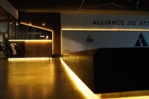 Interior view of Alliance Jiu Jitsu Ramona training facility with modern lighting.