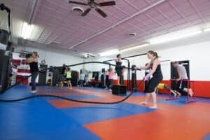 People training in a kickboxing class at United Fitness Kickboxing Bootcamp.