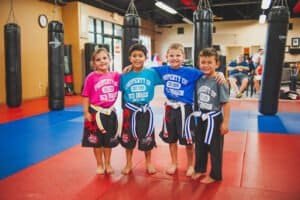 Young kids in martial arts uniforms at Red Dragon Martial Arts & BJJ Center.