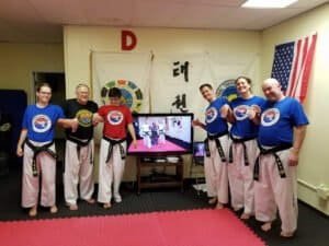 Group of martial artists in uniform at Taylor Martial Arts Academy.