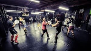 Group of students practicing boxing techniques at UCS gym in Claremont.