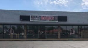 Fitbodies gym storefront with large glass windows and signage.