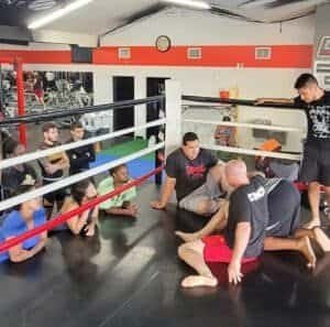 Boxing class with students and instructor at HardWorx Fitness Traffic Circle.