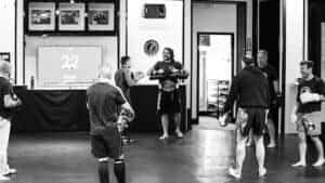 Group of students practicing Brazilian Jiu Jitsu techniques at Port City BJJ.