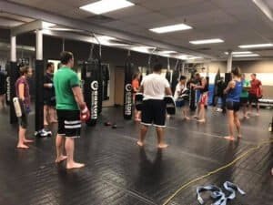 Group of people practicing boxing techniques at Easton Training Center.