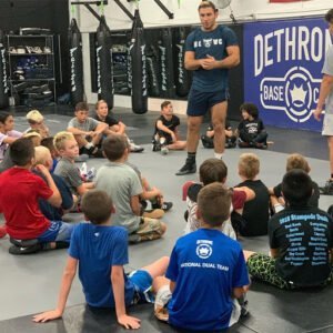 Young children attending a boxing training session at Dethrone MMA gym.