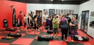 People participating in a boxing class at Park's TaeKwonDo gym.
