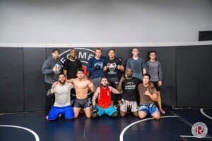 Group of boxers and trainers at Regiment Training Center gym.