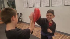 Young boys practicing Kenpo Karate in a martial arts class.