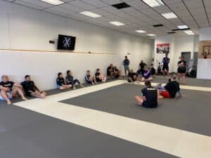 Martial arts class at Orange County Fight Club with students and instructor.