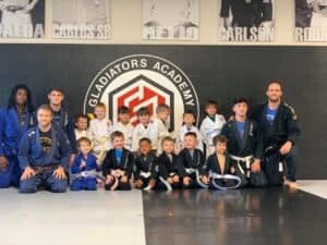 Young kids and instructors at Gladiators Academy of Youngsville martial arts class.
