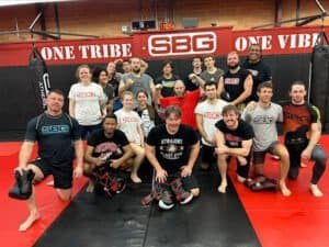 Group of boxers and trainers at SBG Athens gym.