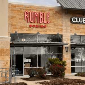 Rumble Boxing gym storefront with large glass windows and signage.