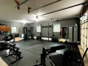 Well-equipped boxing gym with weights and punching bags.