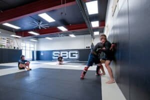 Martial arts students practicing Brazilian Jiu Jitsu at SBG Whitefish gym.