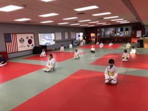 Children practicing martial arts in a dojo at J.K. Lee Black Belt Academy.
