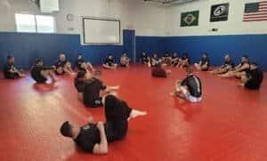Students practicing Jiu-Jitsu techniques in a training session at Academy 440.
