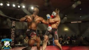 Two fighters in MMA match delivering punches inside the cage.