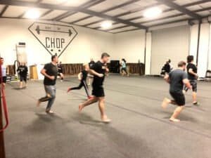 Group of people practicing Krav Maga techniques in Aledo gym.