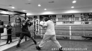 Boxers practicing boxing techniques in Rustam's Boxing Club gym.