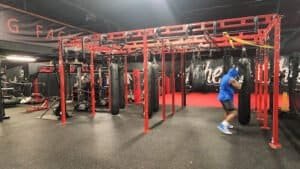 Boxing gym with punching bags and training equipment for boxing practice.