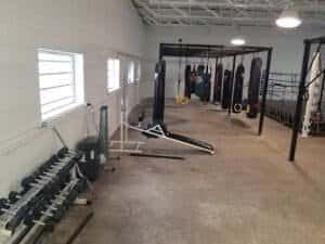 Boxing gym with punching bags, weights, and workout equipment in Dallas Midtown.