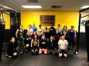 Group of people at CKO Kickboxing Warwick gym for fitness class.