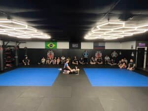 Boxing class with students practicing techniques in a gym.