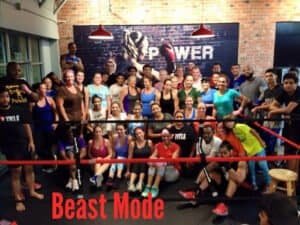 Group photo of diverse boxing class at Machete Fitness gym.